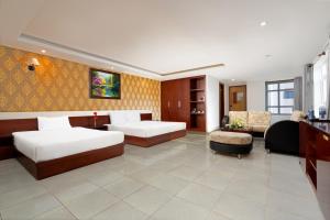 Postel nebo postele na pokoji v ubytování BIDV Beach Hotel Nha Trang
