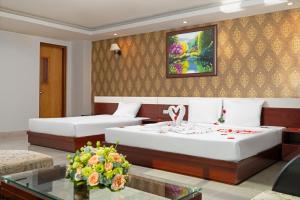 Postel nebo postele na pokoji v ubytování BIDV Beach Hotel Nha Trang