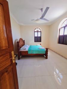 Voodi või voodid majutusasutuse Home Stay Boutique Zanzibar toas