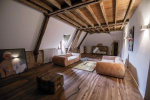 a living room with two chairs and a couch at Chateau de Saint Dau in Figeac