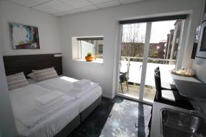 Voodi või voodid majutusasutuse ApartHotel Faber toas