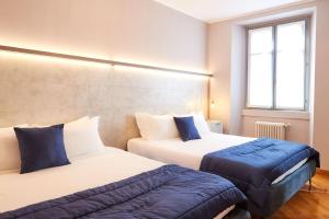 Кровать или кровати в номере Milan Retreats