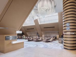a rendering of a restaurant with tables and chairs at Langham Place Guangzhou - Walking distance to Canton Fair in Guangzhou