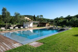 a swimming pool in the middle of a yard at Borgo Isasco in Finale Ligure