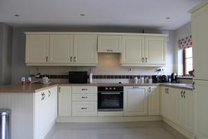 Kuchyň nebo kuchyňský kout v ubytování Cosy Holidayhomes Kerry