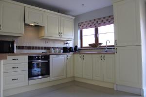 Kuchyň nebo kuchyňský kout v ubytování Cosy Holidayhomes Kerry