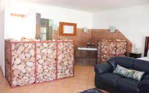 a living room with a pile of fire wood at Umnotho We Afrika House in Erasmus +31 photos