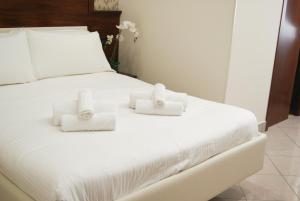 Postel nebo postele na pokoji v ubytování Monti 66 Hotel