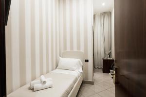 Postel nebo postele na pokoji v ubytování Monti 66 Hotel