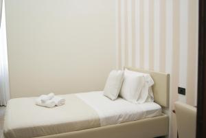 Postel nebo postele na pokoji v ubytování Monti 66 Hotel