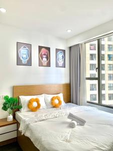 a bedroom with a bed with two teddy bears on it at Golden Apartment in Ho Chi Minh City