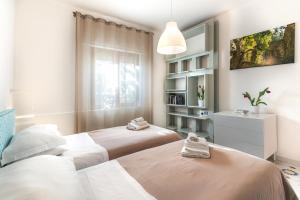 מיטה או מיטות בחדר ב-Sorrento Central Flat