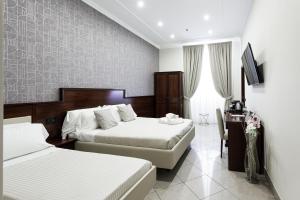 Postel nebo postele na pokoji v ubytování Monti 66 Hotel