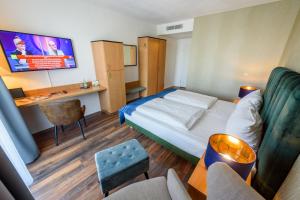 TV a/nebo společenská místnost v ubytování Residenz Hotel Leipzig