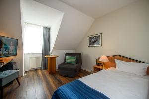 Postel nebo postele na pokoji v ubytování Residenz Hotel Leipzig