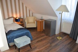 Postel nebo postele na pokoji v ubytování Residenz Hotel Leipzig