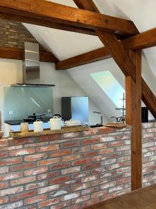 a brick wall in a kitchen with a ceiling at Hofgut Holzmuhle in Germersheim