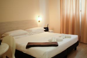 Posteľ alebo postele v izbe v ubytovaní Hp Fly Hotel Bologna