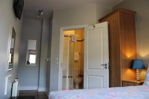 Postel nebo postele na pokoji v ubytování Cosy Holidayhomes Kerry