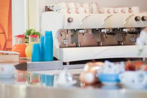 a coffee machine sitting on top of a counter at Hp Fly Hotel Bologna in Calderara di Reno