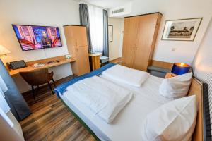 Postel nebo postele na pokoji v ubytování Residenz Hotel Leipzig
