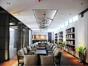 a long dining room with a long table and chairs at H Life Hotel in Shenzhen