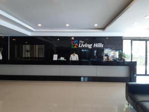 a man standing behind a counter in a restaurant at The Living-Hills in Chiang Mai +48 photos