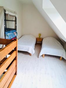Posteľ alebo postele v izbe v ubytovaní Maisonnette du bonheur