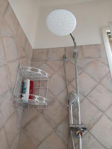 a shower with a shower head in a bathroom at Home Sweet Home in Bologna