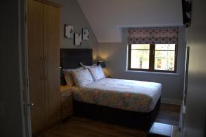 Postel nebo postele na pokoji v ubytování Cosy Holidayhomes Kerry