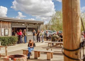 a group of people standing outside of a building at Old Buckenham Country Park in Old Buckenham