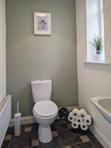 a bathroom with a toilet and a sink at The Old Forge in Bishop Wilton