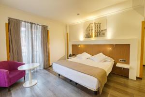 Postel nebo postele na pokoji v ubytování Gran Hotel España + 37 fotografií