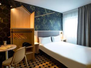 Postel nebo postele na pokoji v ubytování ibis Styles Strasbourg Nord Palais des Congrès
