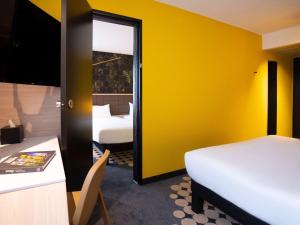 Postel nebo postele na pokoji v ubytování ibis Styles Strasbourg Nord Palais des Congrès