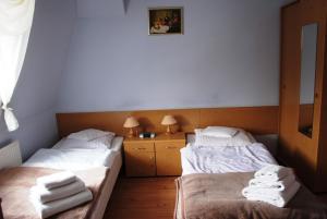 Posteľ alebo postele v izbe v ubytovaní Zameczek