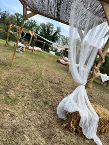 a swing set with a net and hay at Agriturismo Il Campagnino in Cremona