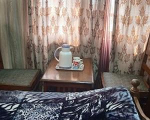 En eller flere senge i et værelse på Flora Cottage , Srinagar