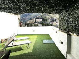 a balcony with benches and a view of a city at Da Ghighì in Tivoli