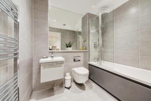 a bathroom with a toilet and a sink and a shower at Solihull Modern Living - 1 Bed Apartment in Solihull
