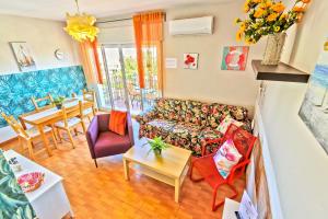 a living room with a couch and a table at Plaza de Toros 3-Bedroom Apartment with Balcony in El Puerto de Santa María
