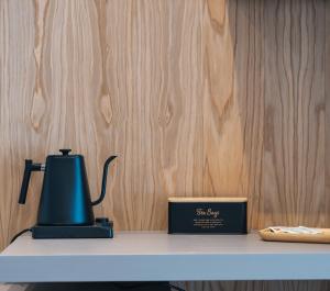 a tea kettle and a box on a table at Park Hotel Bellavista in Gambarie dʼAspromonte
