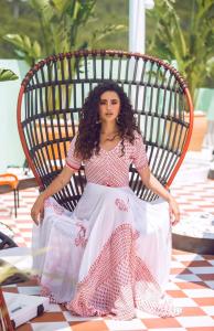 a woman sitting in a wicker chair at Cubanito Ibiza in San Antonio