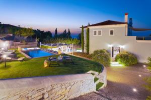 an aerial view of a house with a swimming pool at Villa Tania Samos in Samos