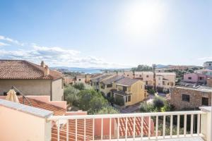 a view of a city from the balcony of a house at "Tramontana" vista mare - 300m dalla spiaggia in Golfo Aranci