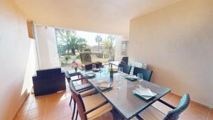 a dining room with a glass table and chairs at Casa Espliego PJ-Murcia Holiday Rentals Property in Torre-Pacheco