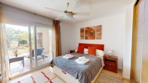 a bedroom with a bed and a sliding glass door at Casa Espliego PJ-Murcia Holiday Rentals Property in Torre-Pacheco +15 photos