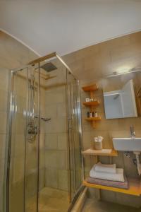 a bathroom with a shower and a sink at Olivemare in Katelios