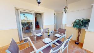 a dining room with a table and chairs at Casa Esturion T-A Murcia Holiday Rentals Property in Roldán
