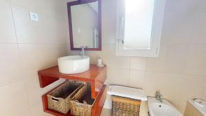 a bathroom with a sink and a mirror and a toilet at Casa Esturion T-A Murcia Holiday Rentals Property in Roldán +22 photos